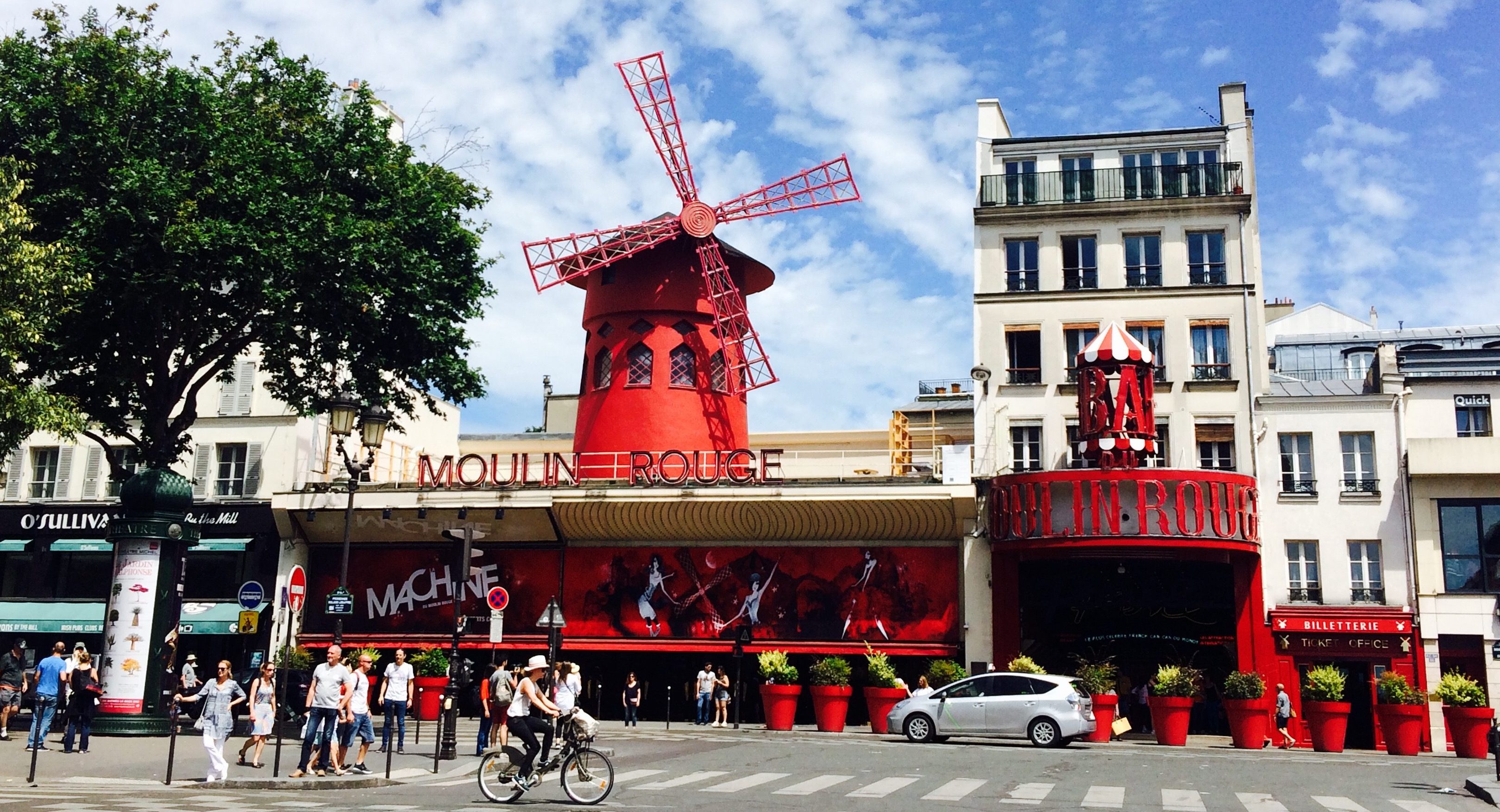 The Moulin Rouge with blue sky behind it