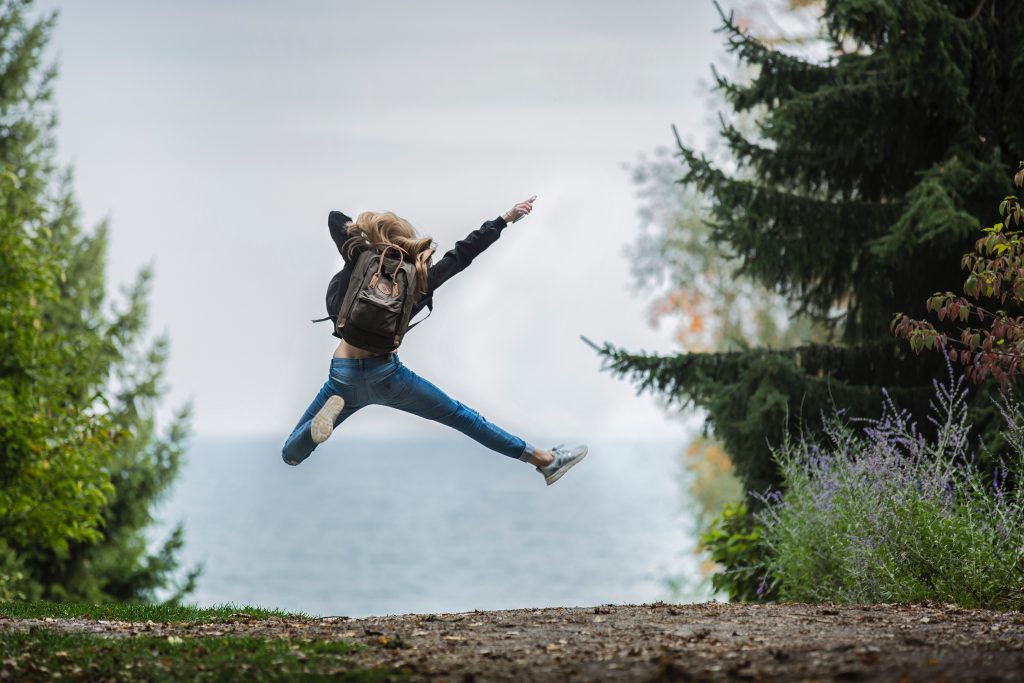 Blonde girl jumping in excitement